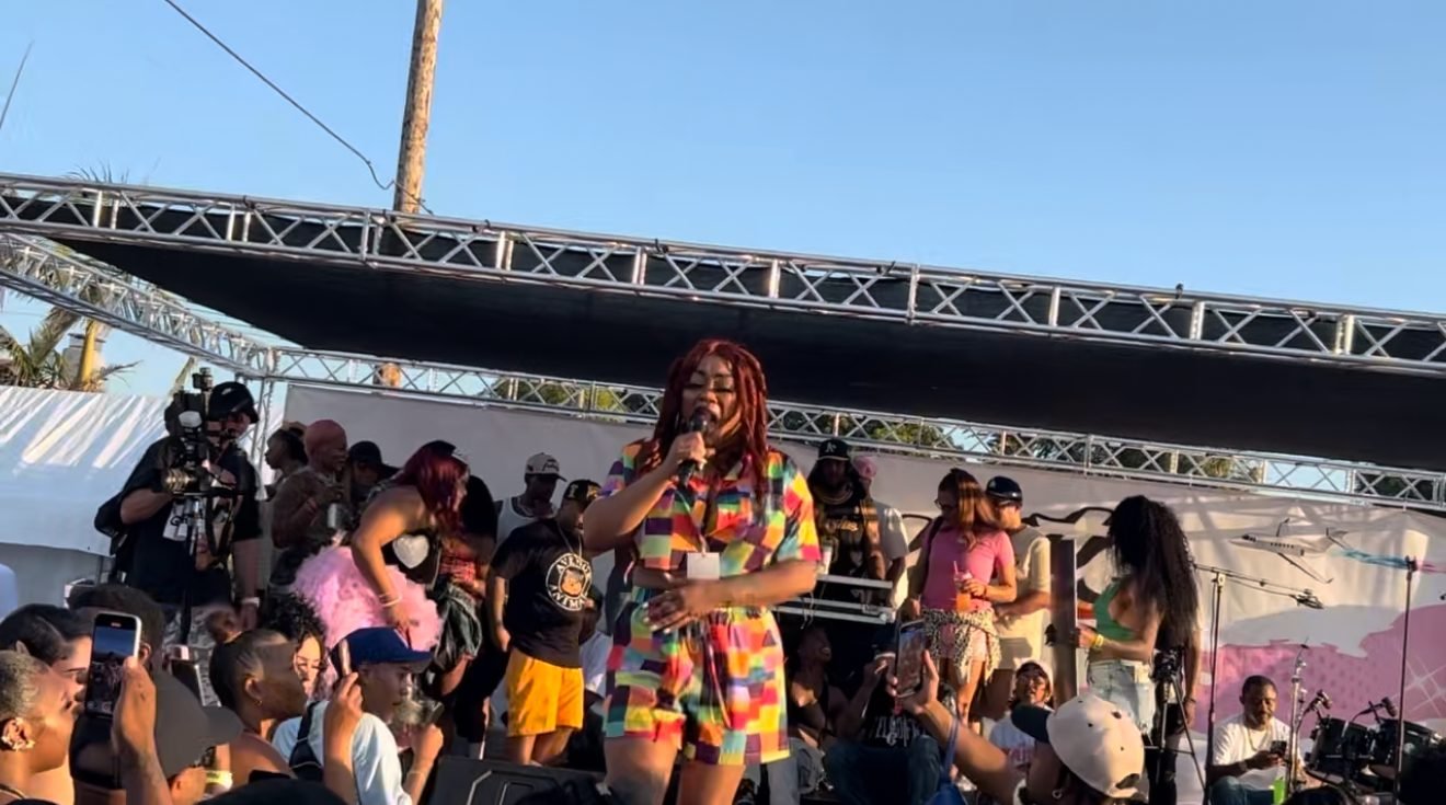 Jay Plush performing live on an outdoor stage