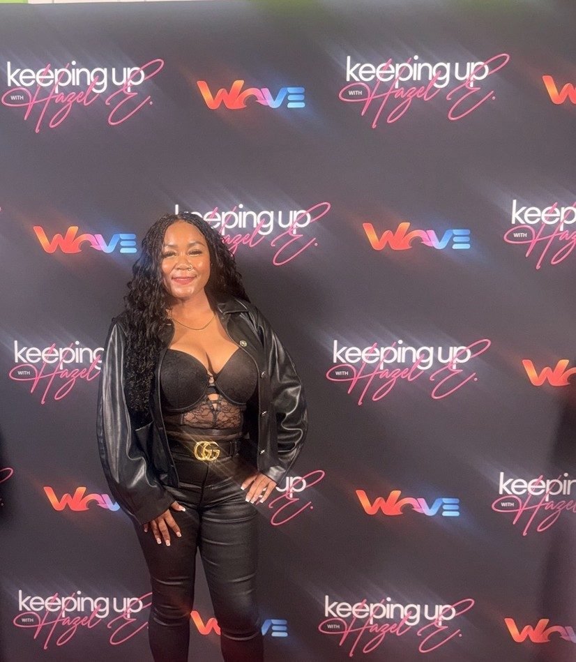 Jay Plush at a press event step-and-repeat